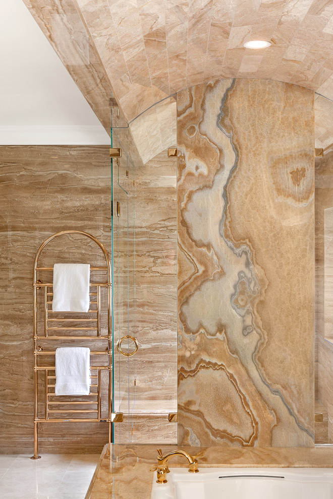 Esempio di un'ampia stanza da bagno padronale chic con consolle stile comò, ante in legno bruno, pavimento in marmo, lavabo sottopiano, top in marmo, vasca sottopiano e piastrelle in pietra