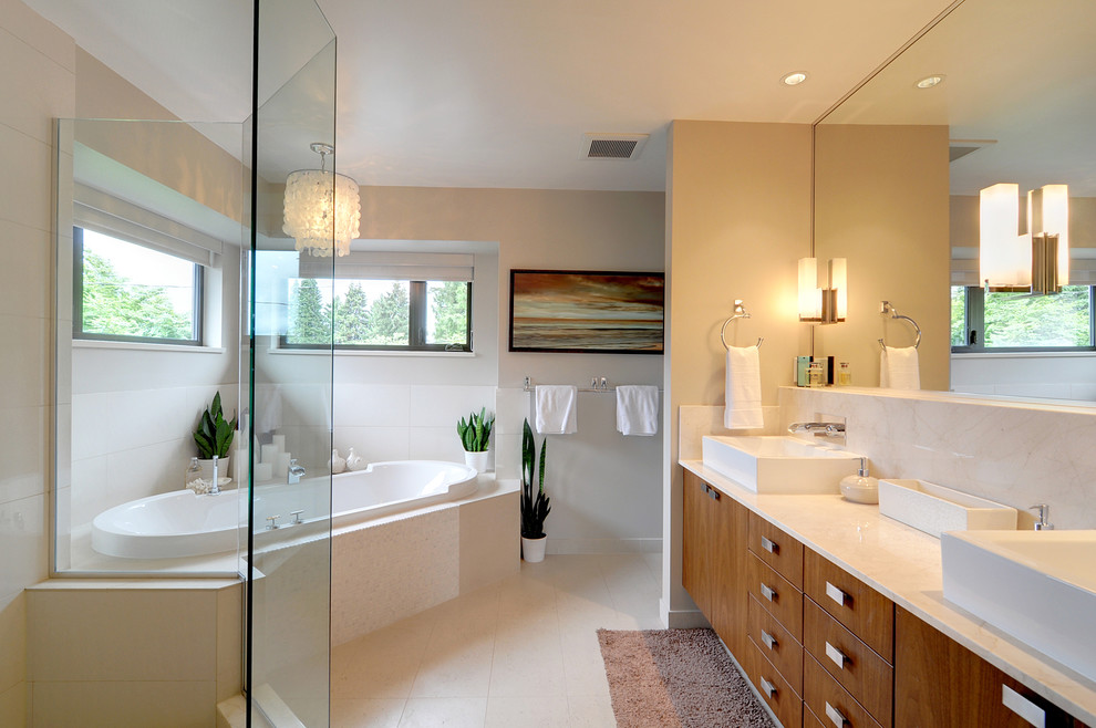 Inspiration for a mid-sized contemporary master beige tile and porcelain tile porcelain tile bathroom remodel in Vancouver with a vessel sink, flat-panel cabinets, medium tone wood cabinets, marble countertops, a one-piece toilet and beige walls