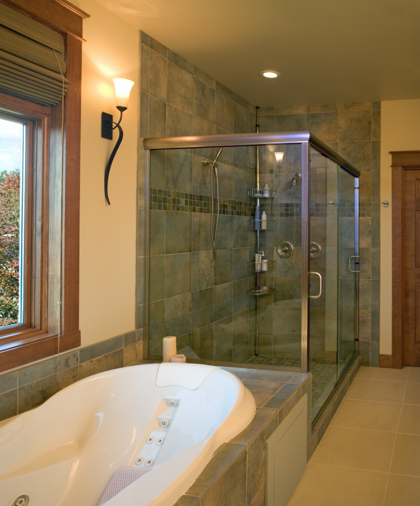 Mid-sized elegant master gray tile and stone slab ceramic tile bathroom photo in Seattle with an undermount sink, raised-panel cabinets, medium tone wood cabinets, granite countertops, a two-piece toilet and beige walls