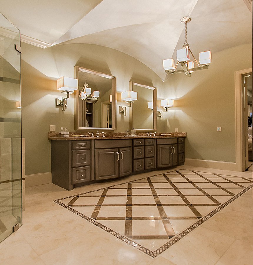 Large classic ensuite bathroom in Houston with a submerged sink, freestanding cabinets, marble worktops, a corner shower, a two-piece toilet, beige tiles, green walls, marble flooring and dark wood cabinets.