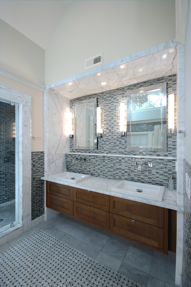 Medium sized contemporary ensuite bathroom in Chicago with a built-in sink, freestanding cabinets, medium wood cabinets, marble worktops, a built-in bath, an alcove shower, a one-piece toilet, white tiles, stone slabs, green walls and mosaic tile flooring.