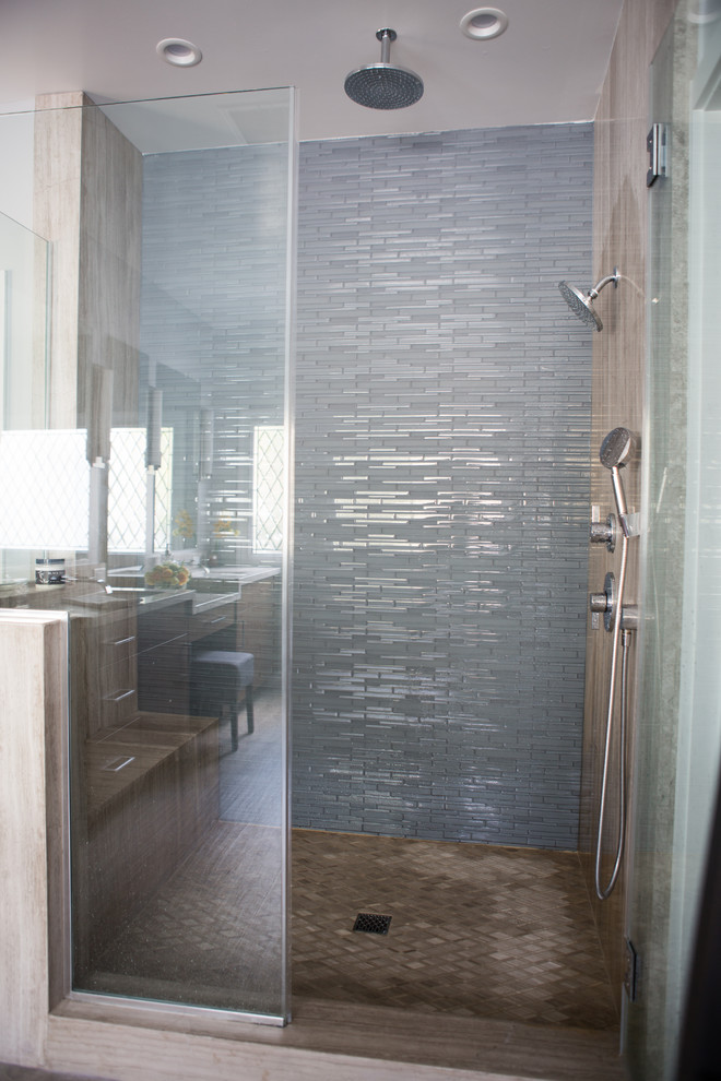 Bathroom - large contemporary master blue tile and glass tile porcelain tile bathroom idea in Los Angeles with flat-panel cabinets, medium tone wood cabinets, gray walls, an undermount sink and limestone countertops
