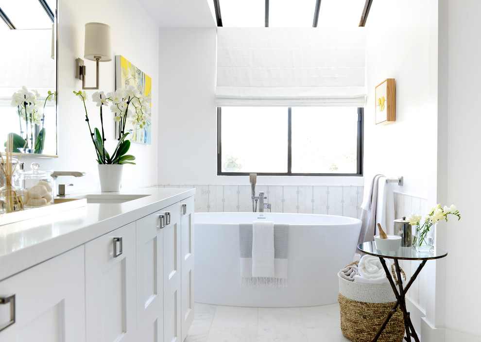 Mid-sized trendy master white tile and mosaic tile marble floor bathroom photo in Los Angeles with shaker cabinets, white cabinets, a two-piece toilet, white walls, an undermount sink and solid surface countertops