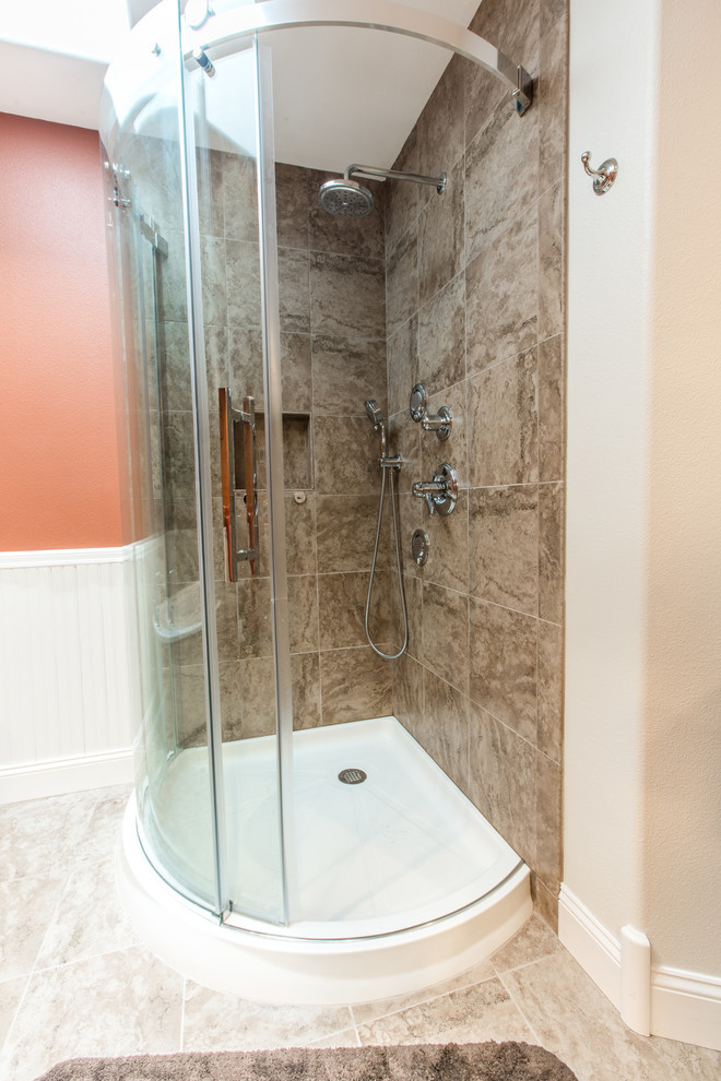 This is an example of a large classic ensuite bathroom in Seattle with a freestanding bath, a corner shower, beige tiles, porcelain tiles, orange walls, porcelain flooring, a vessel sink and engineered stone worktops.