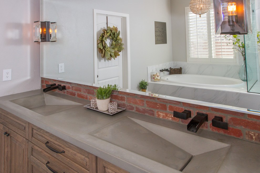 Large urban ensuite bathroom in Santa Barbara with flat-panel cabinets, medium wood cabinets, a built-in bath, a corner shower, a two-piece toilet, white tiles, porcelain tiles, grey walls, porcelain flooring, a trough sink and concrete worktops.
