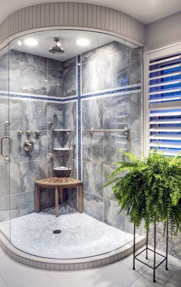 Medium sized classic shower room bathroom in Omaha with raised-panel cabinets, dark wood cabinets, a corner shower, blue tiles, porcelain tiles, grey walls, porcelain flooring, a submerged sink, granite worktops, white floors and a hinged door.