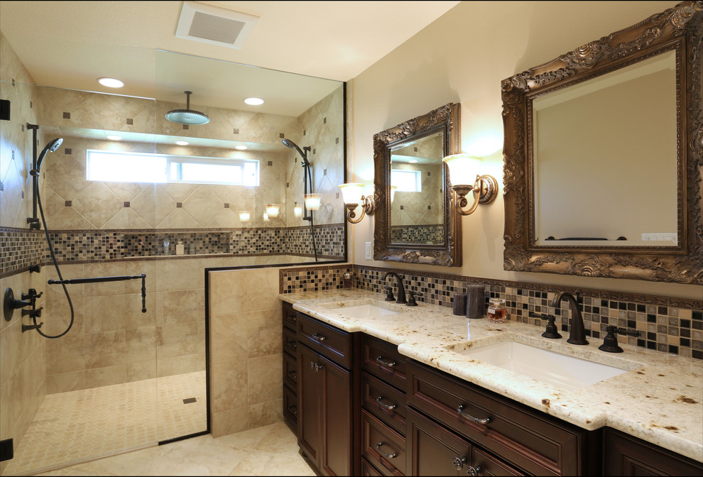 Mid-sized elegant master brown tile and porcelain tile porcelain tile walk-in shower photo in Portland with an undermount sink, recessed-panel cabinets, dark wood cabinets, granite countertops, a one-piece toilet and beige walls