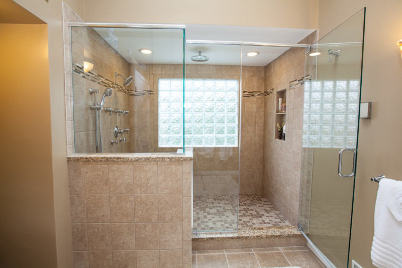 Example of a huge classic master beige tile and stone tile travertine floor alcove shower design in Other with granite countertops, shaker cabinets, medium tone wood cabinets, a two-piece toilet, beige walls and an undermount sink