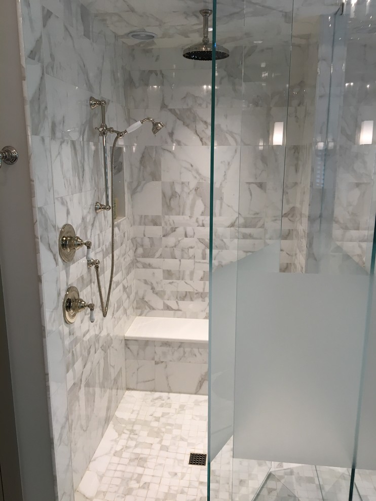Photo of a large contemporary ensuite bathroom in Atlanta with shaker cabinets, grey cabinets, a freestanding bath, a corner shower, grey tiles, white tiles, marble tiles, grey walls, marble flooring, a submerged sink, engineered stone worktops, grey floors, a hinged door and white worktops.