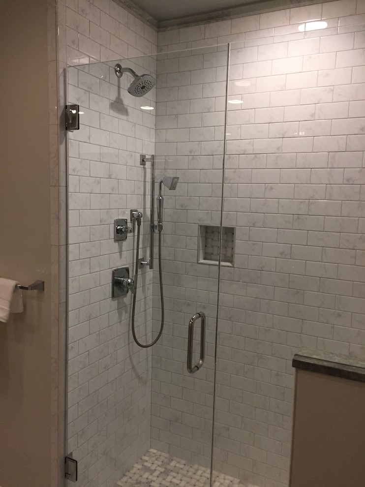 Small classic ensuite bathroom in Other with recessed-panel cabinets, grey cabinets, an alcove shower, a two-piece toilet, white tiles, porcelain tiles, grey walls, ceramic flooring, a built-in sink and granite worktops.