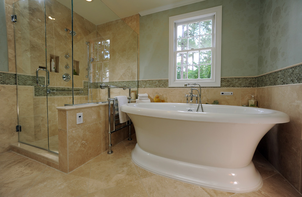Design ideas for a traditional half tiled bathroom in Miami with a freestanding bath and travertine tiles.
