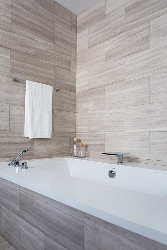 Bathroom - mid-sized contemporary master gray tile travertine floor bathroom idea in Los Angeles with an undermount tub, white walls, a vessel sink and quartz countertops