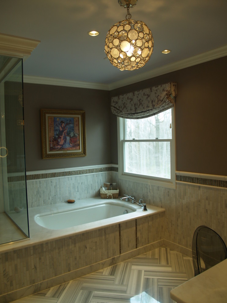 Classic bathroom in New York with a submerged bath, grey tiles, white tiles, glass tiles and brown walls.