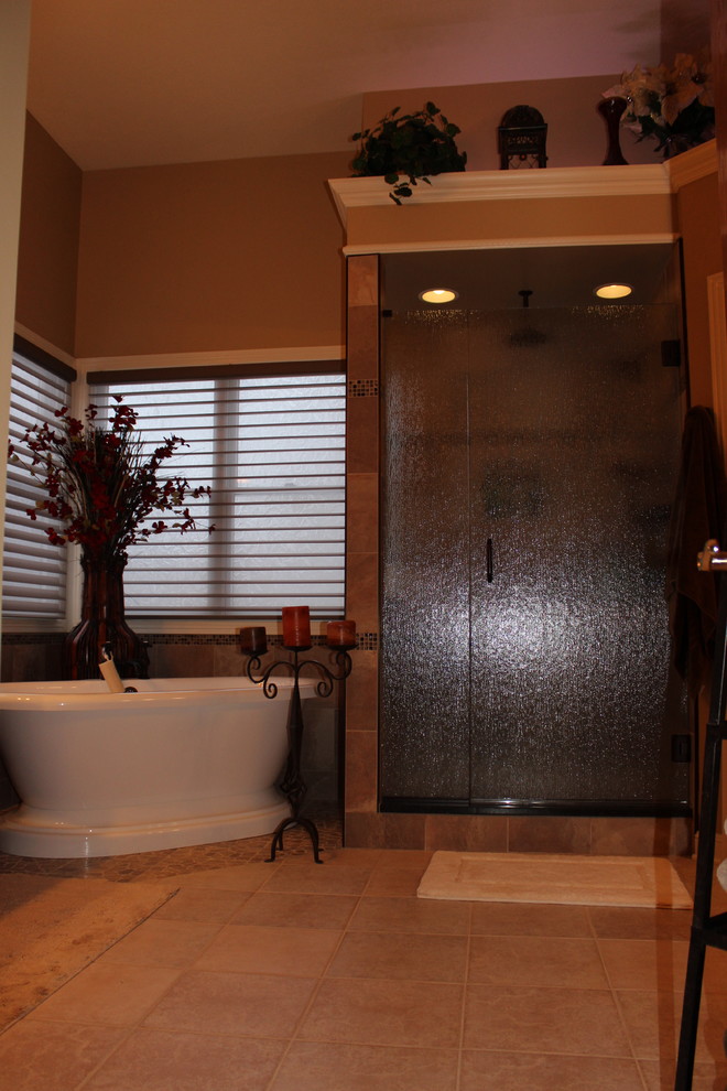Bathroom - traditional brown tile and mosaic tile bathroom idea in Cleveland with a vessel sink, raised-panel cabinets, medium tone wood cabinets, granite countertops and a one-piece toilet