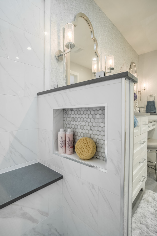 Inspiration for a small classic ensuite bathroom in Dallas with shaker cabinets, white cabinets, a corner shower, a two-piece toilet, white tiles, marble tiles, grey walls, porcelain flooring, a submerged sink, engineered stone worktops, grey floors and a hinged door.