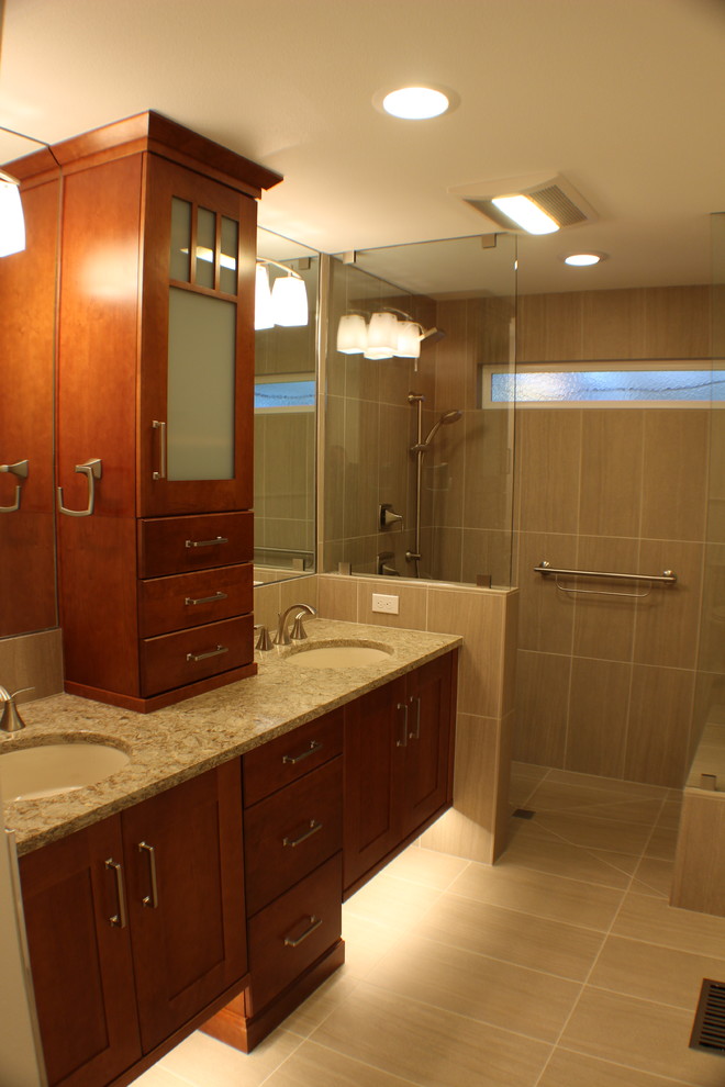 Medium sized traditional ensuite bathroom in Other with recessed-panel cabinets, porcelain tiles, porcelain flooring, a submerged sink, beige floors, an open shower, medium wood cabinets, a built-in shower, a two-piece toilet, brown tiles, white walls, engineered stone worktops, beige worktops, double sinks and a built in vanity unit.