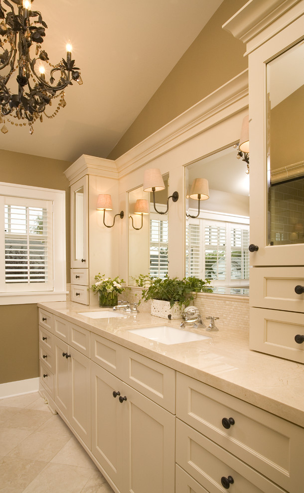Inspiration for a timeless beige tile and travertine tile bathroom remodel in Seattle with an undermount sink, shaker cabinets, beige cabinets and beige countertops