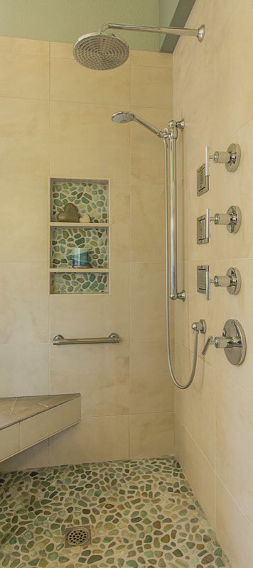 This is an example of a large traditional ensuite bathroom in San Francisco with a built-in sink, raised-panel cabinets, medium wood cabinets, engineered stone worktops, a built-in bath, a corner shower, a two-piece toilet, green tiles, pebble tiles, green walls and porcelain flooring.