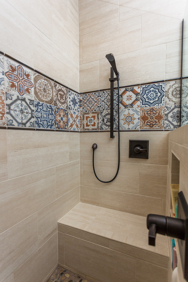 Photo of a large shower room bathroom in Phoenix with recessed-panel cabinets, medium wood cabinets, a corner shower, beige tiles, porcelain tiles, beige walls, travertine flooring, a submerged sink, engineered stone worktops, brown floors and a hinged door.