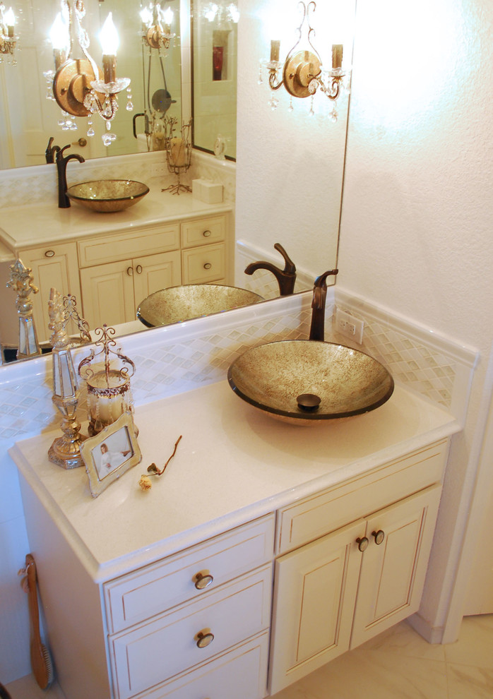 Small traditional ensuite bathroom in Denver with a vessel sink, raised-panel cabinets, white cabinets, granite worktops, a claw-foot bath, a built-in shower, a two-piece toilet, white tiles, ceramic tiles, white walls and ceramic flooring.