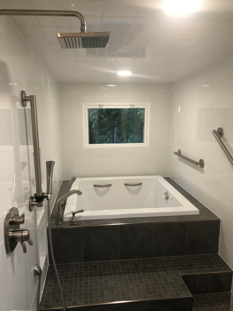 Example of a large minimalist master white tile and ceramic tile ceramic tile, black floor and double-sink bathroom design in Indianapolis with shaker cabinets, gray cabinets, a bidet, white walls, an undermount sink, quartz countertops, a hinged shower door, white countertops, a niche and a freestanding vanity