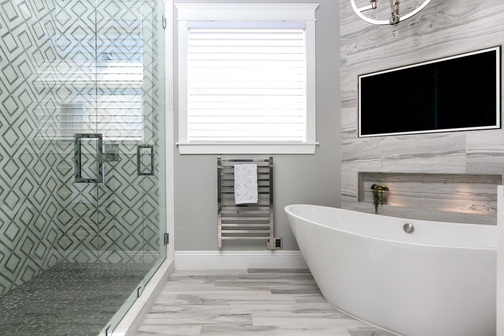 Example of a mid-sized transitional master gray tile and porcelain tile porcelain tile and gray floor bathroom design in San Diego with shaker cabinets, gray cabinets, a one-piece toilet, gray walls, an undermount sink, quartz countertops, a hinged shower door and white countertops
