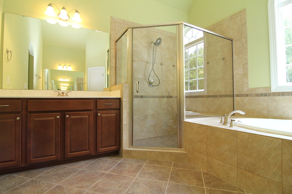 Bathroom - large traditional master beige tile and ceramic tile ceramic tile bathroom idea in Raleigh with raised-panel cabinets, dark wood cabinets, a one-piece toilet and green walls