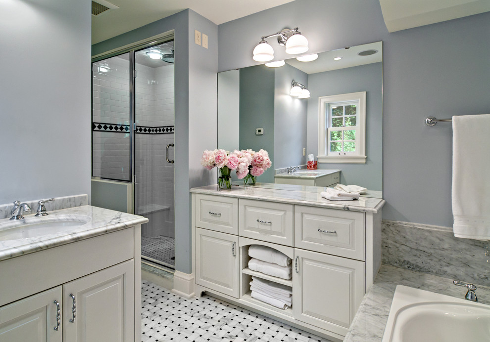 Traditional bathroom in Minneapolis with raised-panel cabinets and white cabinets.