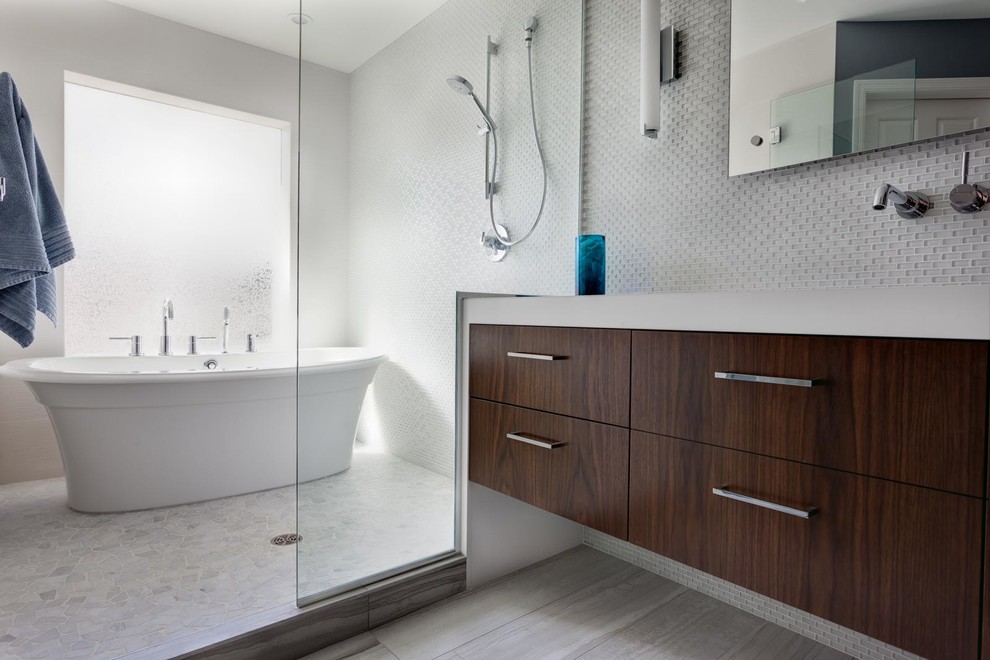 This is an example of a small classic ensuite bathroom in Dallas with flat-panel cabinets, dark wood cabinets, a freestanding bath, a double shower, a two-piece toilet, white tiles, stone tiles, white walls, mosaic tile flooring, a submerged sink, engineered stone worktops, grey floors and an open shower.