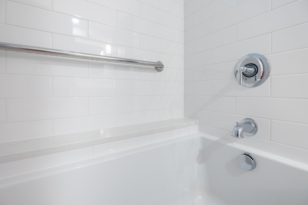 Example of a mid-sized classic master white tile and ceramic tile porcelain tile bathroom design in Portland with recessed-panel cabinets, white cabinets, a two-piece toilet, blue walls, an undermount sink and quartz countertops