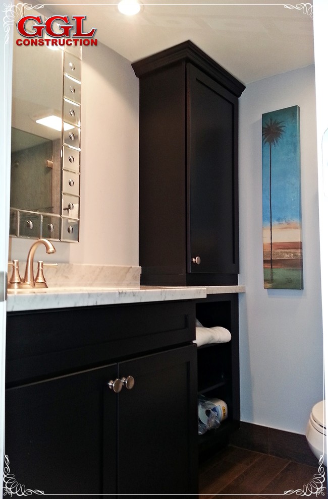 This is an example of a beach style bathroom in Miami with a submerged sink, shaker cabinets, black cabinets, marble worktops, brown tiles, porcelain tiles, grey walls and porcelain flooring.