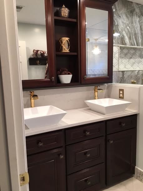 Bathroom - mid-sized transitional master multicolored tile and stone slab marble floor and multicolored floor bathroom idea in DC Metro with raised-panel cabinets, dark wood cabinets, a two-piece toilet, white walls, a vessel sink and quartz countertops