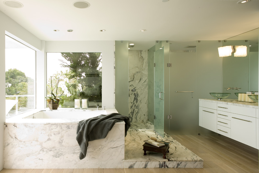 Alcove shower - modern alcove shower idea in San Francisco with a vessel sink, flat-panel cabinets, white cabinets and an undermount tub