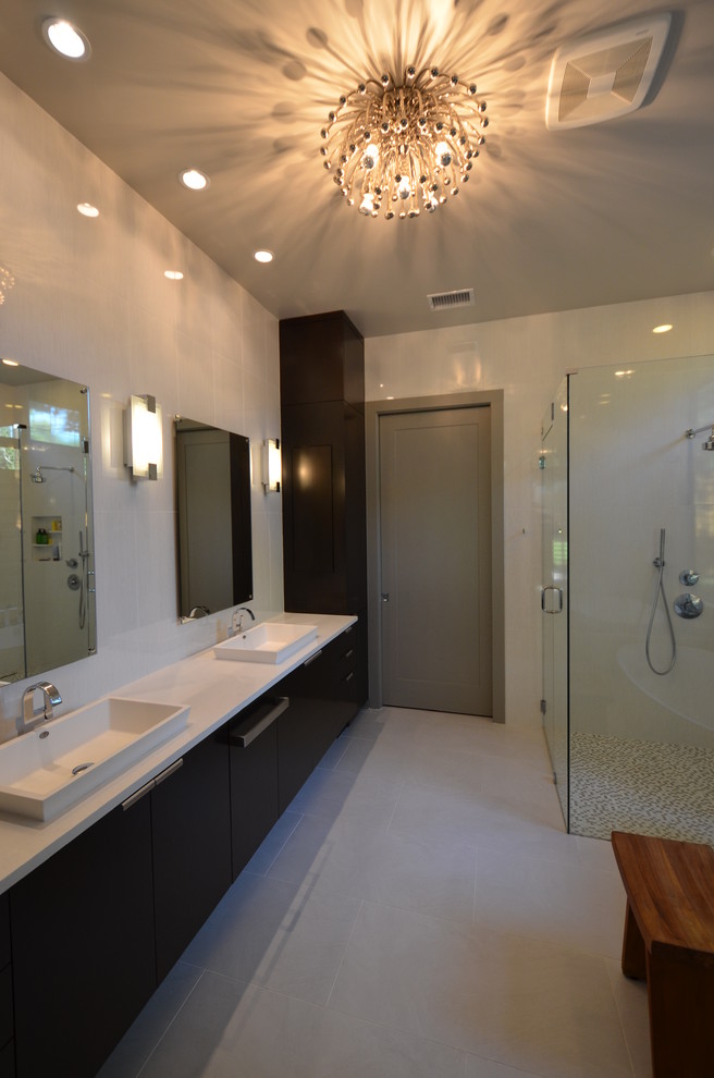 Large minimalist master gray tile and porcelain tile porcelain tile bathroom photo in Dallas with a drop-in sink, flat-panel cabinets, dark wood cabinets, quartz countertops, a one-piece toilet and gray walls