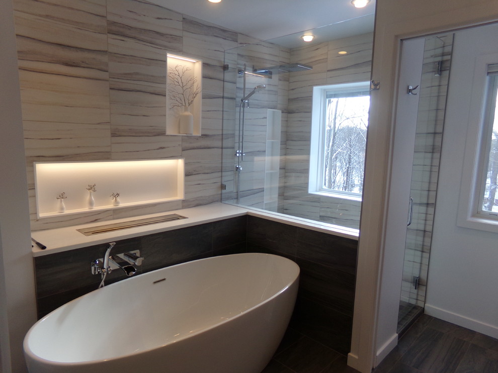 Large trendy master brown tile and porcelain tile porcelain tile bathroom photo in New York with flat-panel cabinets, medium tone wood cabinets, a two-piece toilet, white walls, an undermount sink and quartz countertops