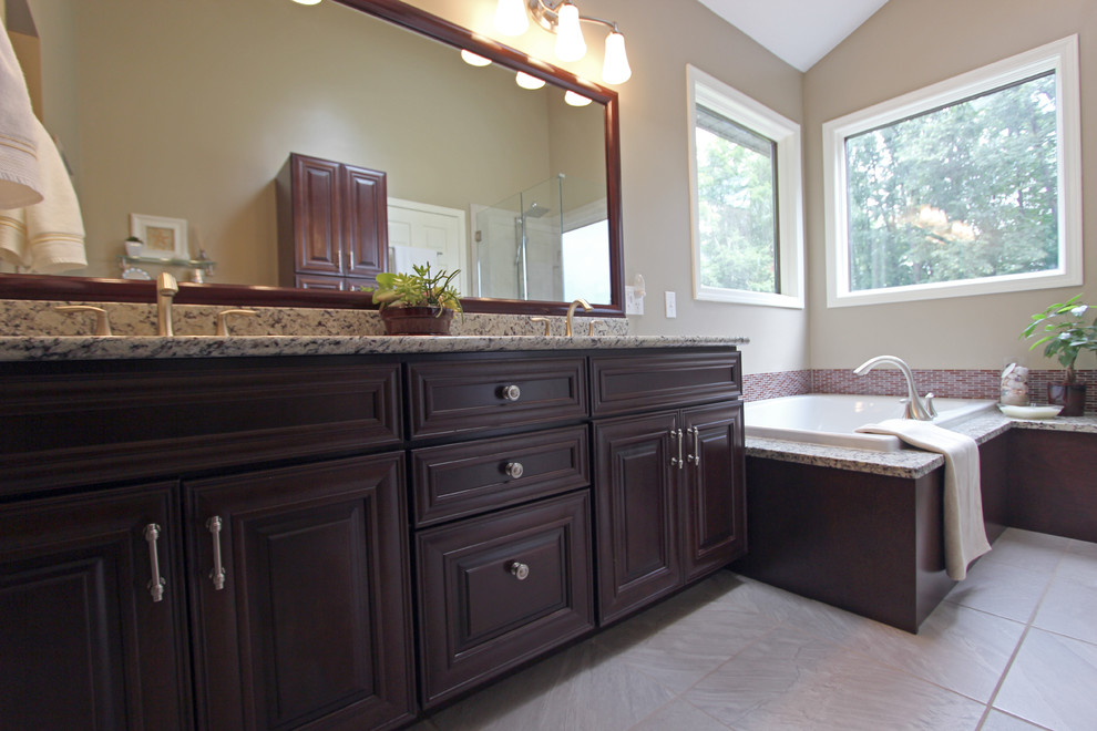 Master Bath with Cherry and Granite Countertops Traditional
