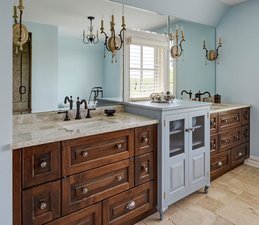 Inspiration for a mid-sized timeless master limestone floor and beige floor bathroom remodel in Chicago with blue walls, an undermount sink, granite countertops, beige countertops, dark wood cabinets and recessed-panel cabinets