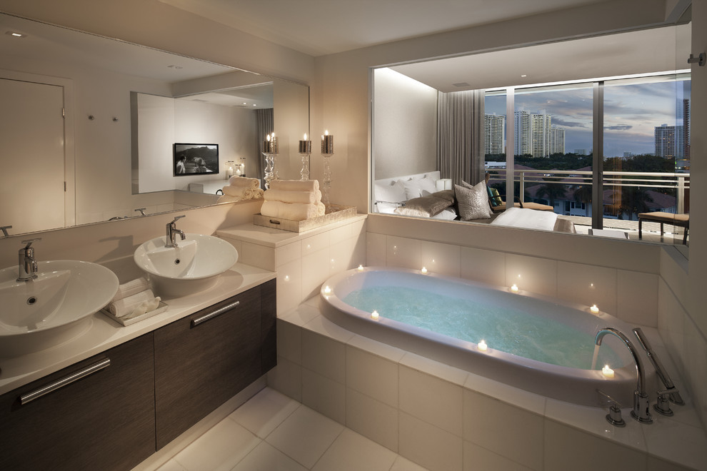 Mid-sized trendy master white tile bathroom photo in Miami with a vessel sink, marble countertops and beige walls