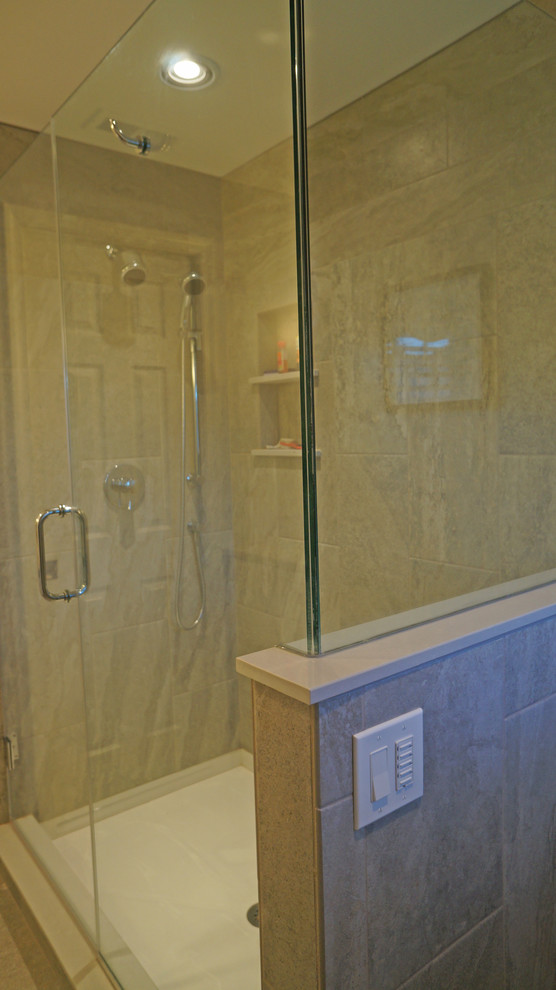 Alcove shower - mid-sized traditional master gray tile and porcelain tile porcelain tile alcove shower idea in Philadelphia with recessed-panel cabinets, white cabinets, a two-piece toilet, gray walls, an undermount sink and granite countertops