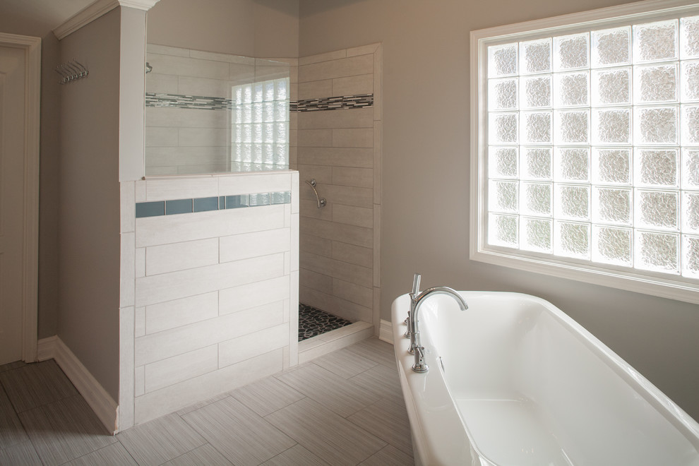 Bathroom - large transitional master gray tile and porcelain tile porcelain tile and beige floor bathroom idea in Kansas City with an undermount sink, recessed-panel cabinets, white cabinets, quartz countertops and gray walls