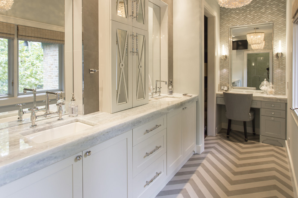 Inspiration for a large transitional master gray tile and porcelain tile bathroom remodel in Houston with an undermount sink, furniture-like cabinets, white cabinets, quartzite countertops, a wall-mount toilet and gray walls