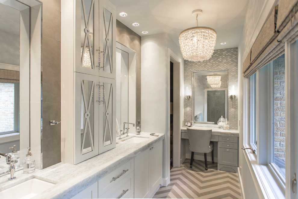 This is an example of a large traditional ensuite bathroom in Houston with a submerged sink, freestanding cabinets, white cabinets, quartz worktops, a freestanding bath, a shower/bath combination, a wall mounted toilet, grey tiles, porcelain tiles, grey walls and porcelain flooring.