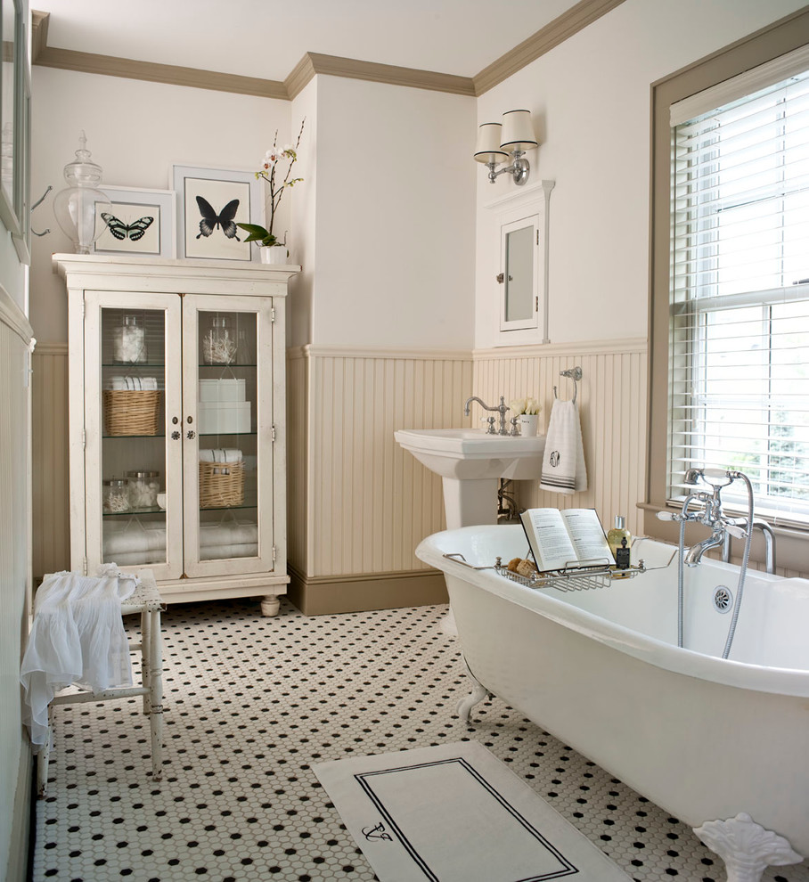 Inspiration for a timeless claw-foot bathtub remodel in Other with a pedestal sink