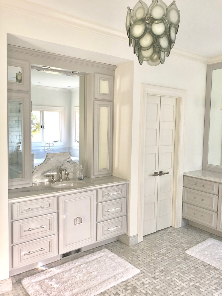 Inspiration for a medium sized classic ensuite bathroom in Other with louvered cabinets, grey cabinets, a freestanding bath, a corner shower, a one-piece toilet, grey tiles, marble tiles, grey walls, marble flooring, a submerged sink, marble worktops, grey floors, a hinged door and grey worktops.