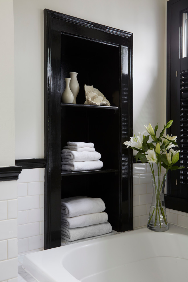 Large transitional master black and white tile ceramic tile bathroom photo in Chicago with black cabinets and white walls