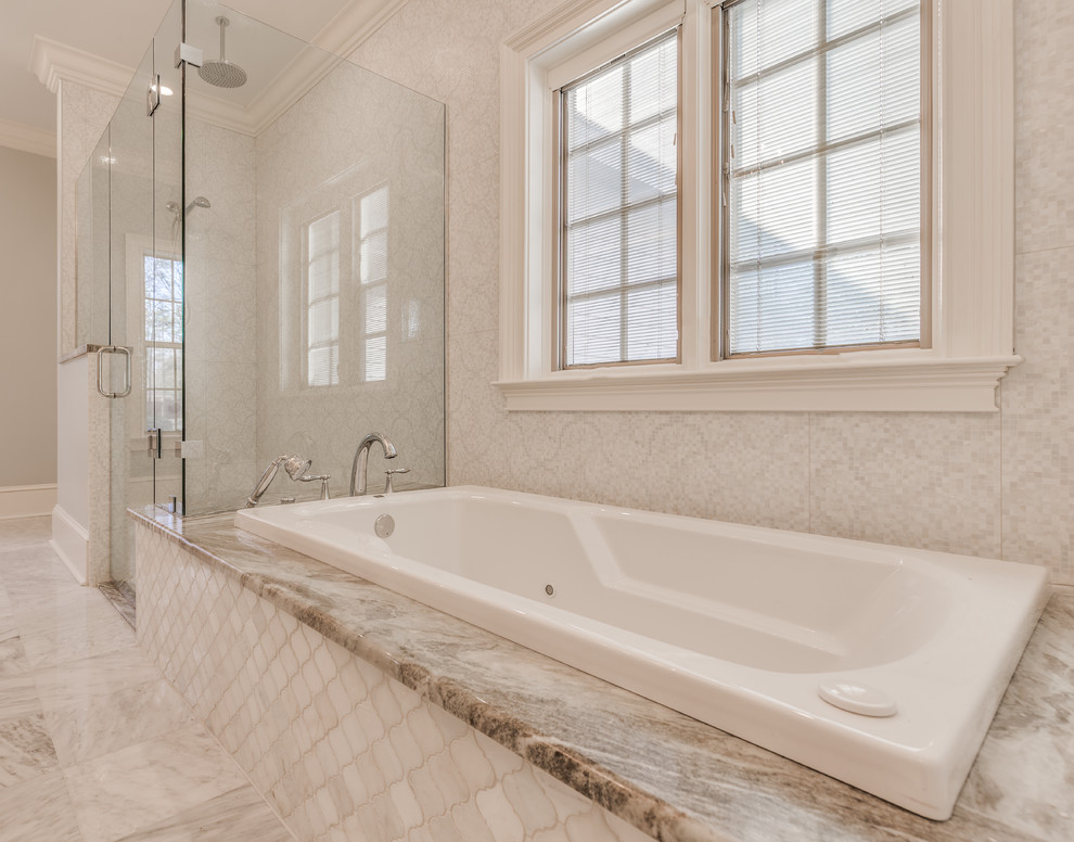 Large elegant master white tile and stone tile marble floor bathroom photo in Jacksonville with beaded inset cabinets, white cabinets, blue walls, granite countertops and an undermount sink
