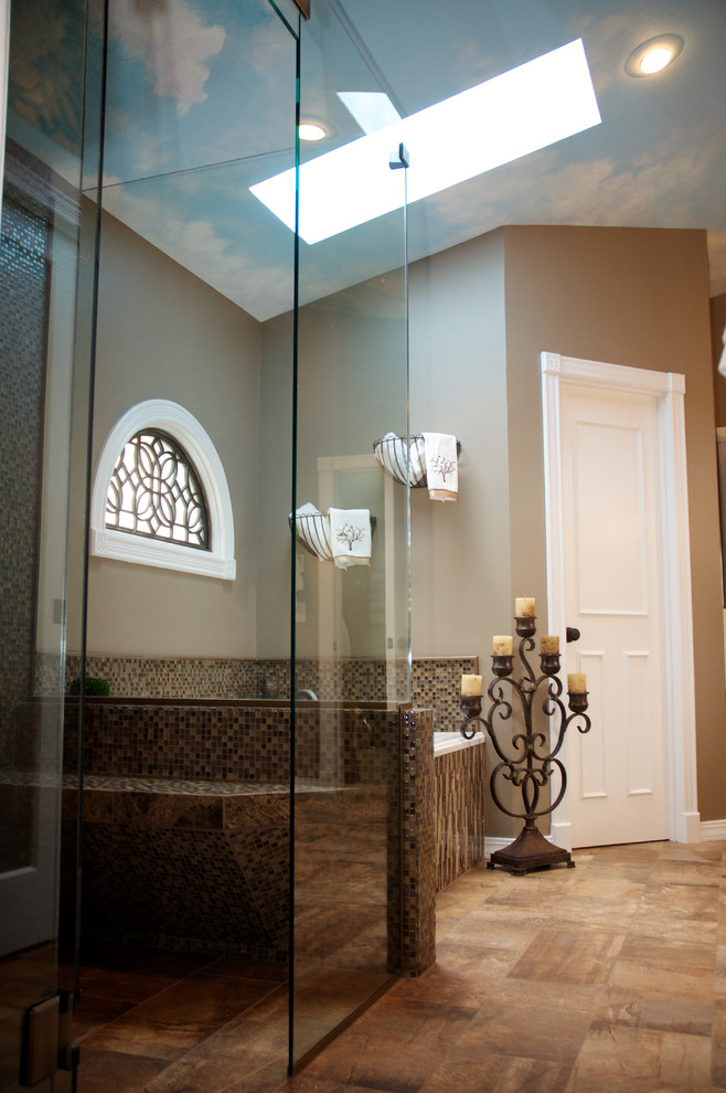 Walk-in shower - mid-sized transitional master mosaic tile and brown tile porcelain tile walk-in shower idea in Other with an undermount sink, white cabinets, quartz countertops, beige walls, raised-panel cabinets and a two-piece toilet