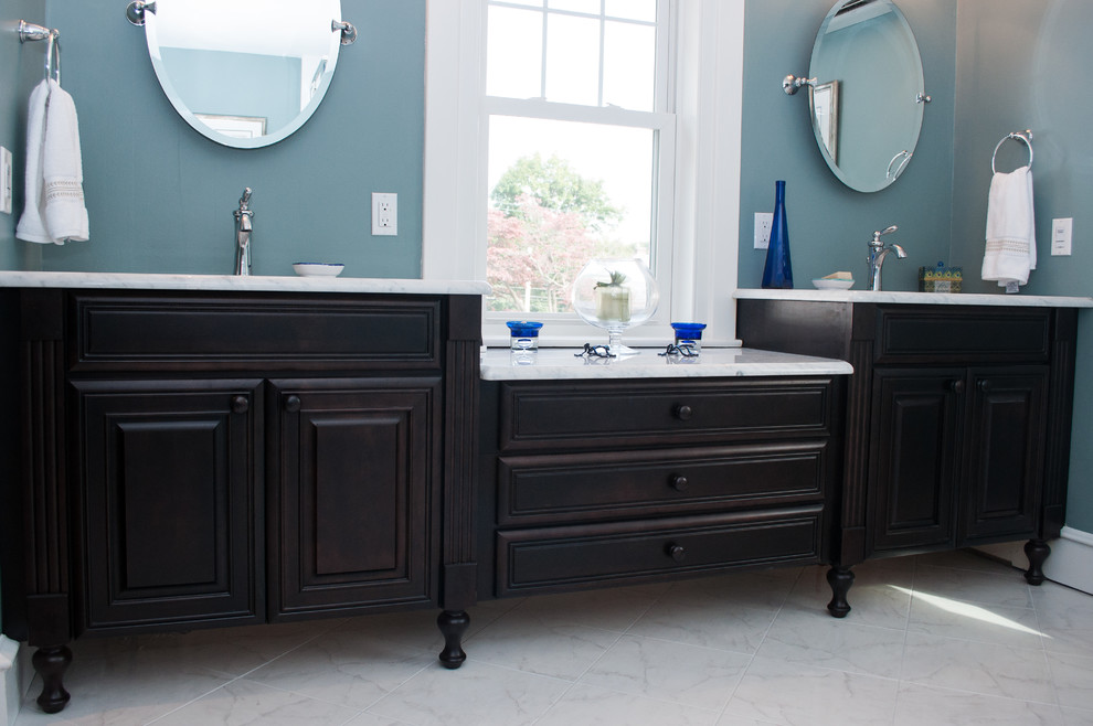 Example of a large classic master white tile and porcelain tile porcelain tile bathroom design in Philadelphia with an undermount sink, furniture-like cabinets, dark wood cabinets, marble countertops, a two-piece toilet and blue walls