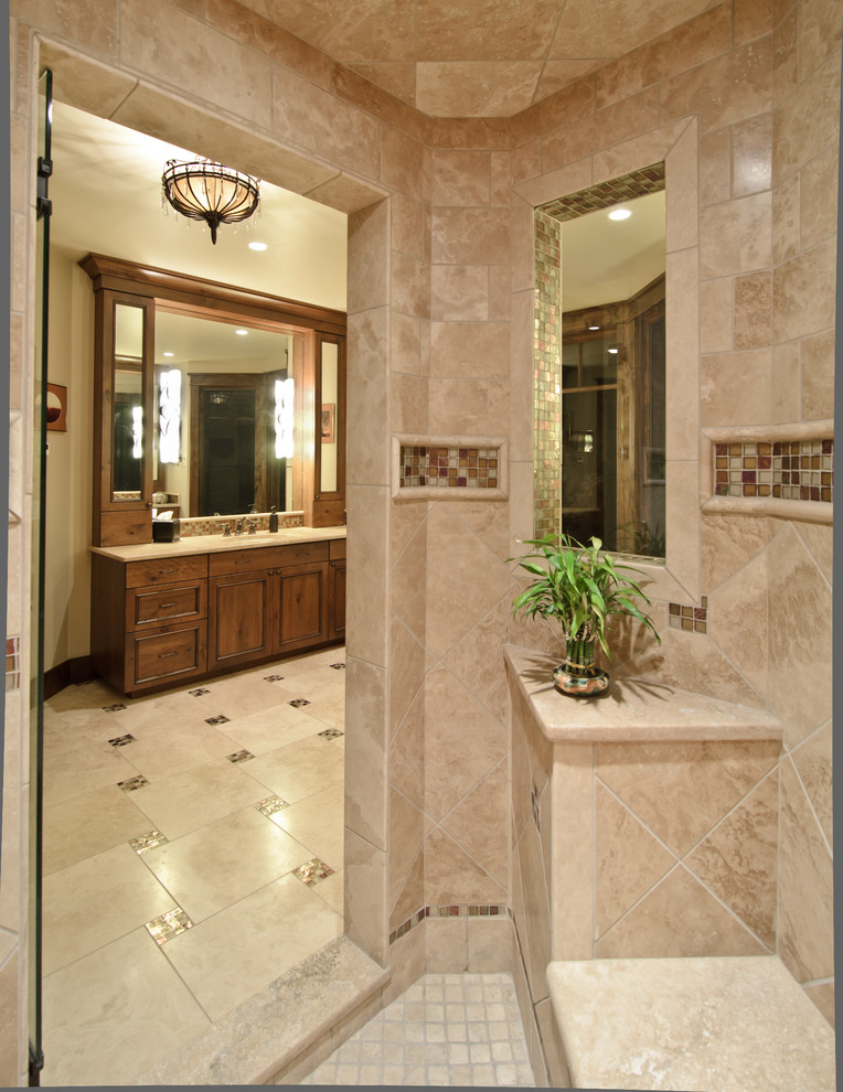 This is an example of a classic bathroom in Denver with mosaic tiles and feature lighting.