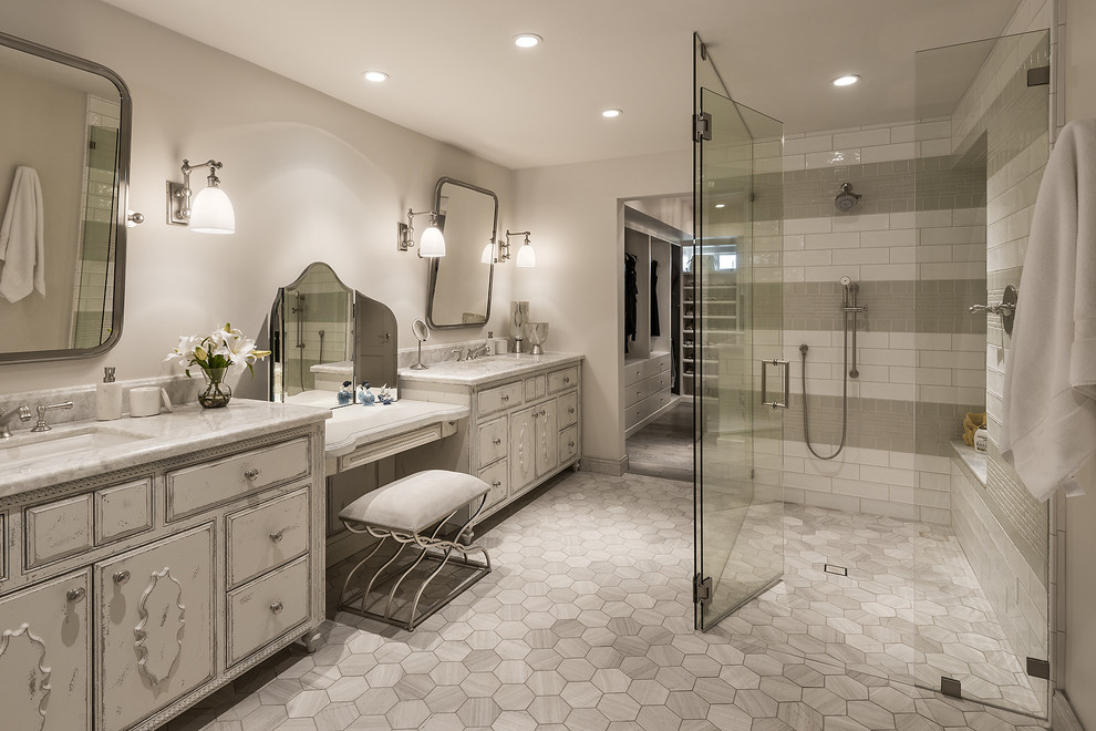 This is an example of a romantic ensuite bathroom in Phoenix with freestanding cabinets, white cabinets, a submerged bath, a walk-in shower, multi-coloured tiles, ceramic tiles, grey walls, limestone flooring, a submerged sink, granite worktops, grey floors and a hinged door.